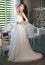 Beautiful bride in a magnificent white wedding dress of tulle with a corset