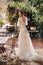 A beautiful bride with pleasant features in a wedding dress is photographed in Provence. Portrait of the bride in France