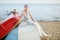 Beautiful bride sitting on a boat