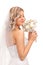 Beautiful bride smelling wedding bouquet