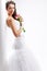 Beautiful bride standing near white column