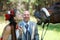 Beautiful bride teasing horse, shows her teeth