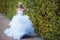 Beautiful bride walking in the park near castle