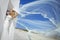 Beautiful bride in a wedding dress in greece with a long veil