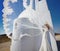 Beautiful bride in a wedding dress in greece with a long veil