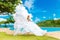 Beautiful bride in wedding dress with long train standing at the