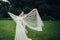 The beautiful bride in a white poses in the park