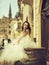 Beautiful bride on wooden barrel