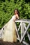 Beautiful bride on the wooden bridge