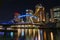 Beautiful bridge over river and cityscape at night