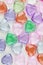 Beautiful bright background from decorative multi-colored hearts.