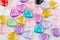 Beautiful bright background from decorative multi-colored hearts.