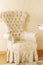 Beautiful bright chair with brushes in room