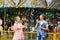 A beautiful bright cheerful romantic couple in love enjoy soap bubbles in an amusement Park