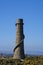 Beautiful bright close-up vertical view of Ballycorus lead mining and smelting chimney tower against perfectly clear blue sky