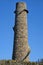 Beautiful bright close-up vertical view of Ballycorus lead mining and smelting chimney tower against perfectly clear blue sky