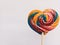 Beautiful bright colorful lollipops like a rainbow shaped like a heart isolated on a white background
