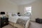 Beautiful bright modern furnished new home staged bedroom