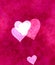 Beautiful bright shiny hearts on cloudy messy bright pink background
