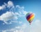 Beautiful bright striped balloon against the blue sky. Travel dr