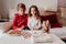 beautiful brother and sister at home having a delicious snack. Christmas concept