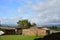 Beautiful brown barn with lush green grass