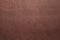 A beautiful brown color handmade paper of wave or rough texture with veins and fibers.