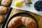 Beautiful brunch flat lay of home baked croissants and healthy fresh blueberry and lemon citrus fruit