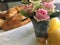 Beautiful brunch home baked croissants, roses and healthy fresh lemons