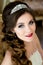 Beautiful brunette Bride portrait wedding makeup and hairstyle with diamond crown