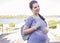 Beautiful brunette caucasian pregnant woman on summer walk outdo