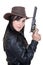 Beautiful brunette cowgirl model holding a gun