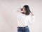 Beautiful brunette girl braces happy white sweater,holiday dancing, emotion