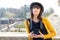 Beautiful brunette girl with camera visiting french city, Pau