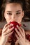 Beautiful brunette girl eating pomegranate, from above