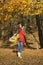 Beautiful brunette guitar player girl in the forest
