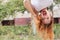 Beautiful brunette plus size woman upside down. Her hair flaws. Summer outdoor portrait, copy space