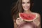Beautiful brunette woman eating watermelon on a white background, healthy food, tasty food, organic diet, smile healthy, blac