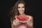 Beautiful brunette woman eating watermelon on a white background, healthy food, tasty food, organic diet, smile healthy, blac