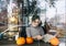 Beautiful brunette woman looks on menu at city cafe