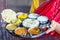 Beautiful brunette woman in red sari eating with appetite traditional thali wirh rise,curd,dal in Goa restaurant masala