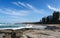 Beautiful Buddina Beach on the Sunshine Coast of Australia with beautiful turquoise water and unidentifiablee people down the beac