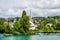 Beautiful buildings and a gothic church on the hills and the lakeshore of Lake of Zurich, Switzerland