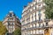 Beautiful buildings in Square des Batignolles, typical Parisian facade