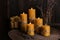 Beautiful burning beeswax candles and dried lavender flowers on table