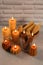 Beautiful burning beeswax candles on light textured table