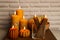 Beautiful burning beeswax candles on wooden table