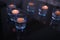 Beautiful burning candles on dark table