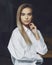 Beautiful business woman. Blonde in white shirt. Purposeful woman posing with crossed arms.  female portrait.