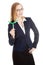 Beautiful business woman holding small green propeller.